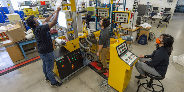 students testing a machine